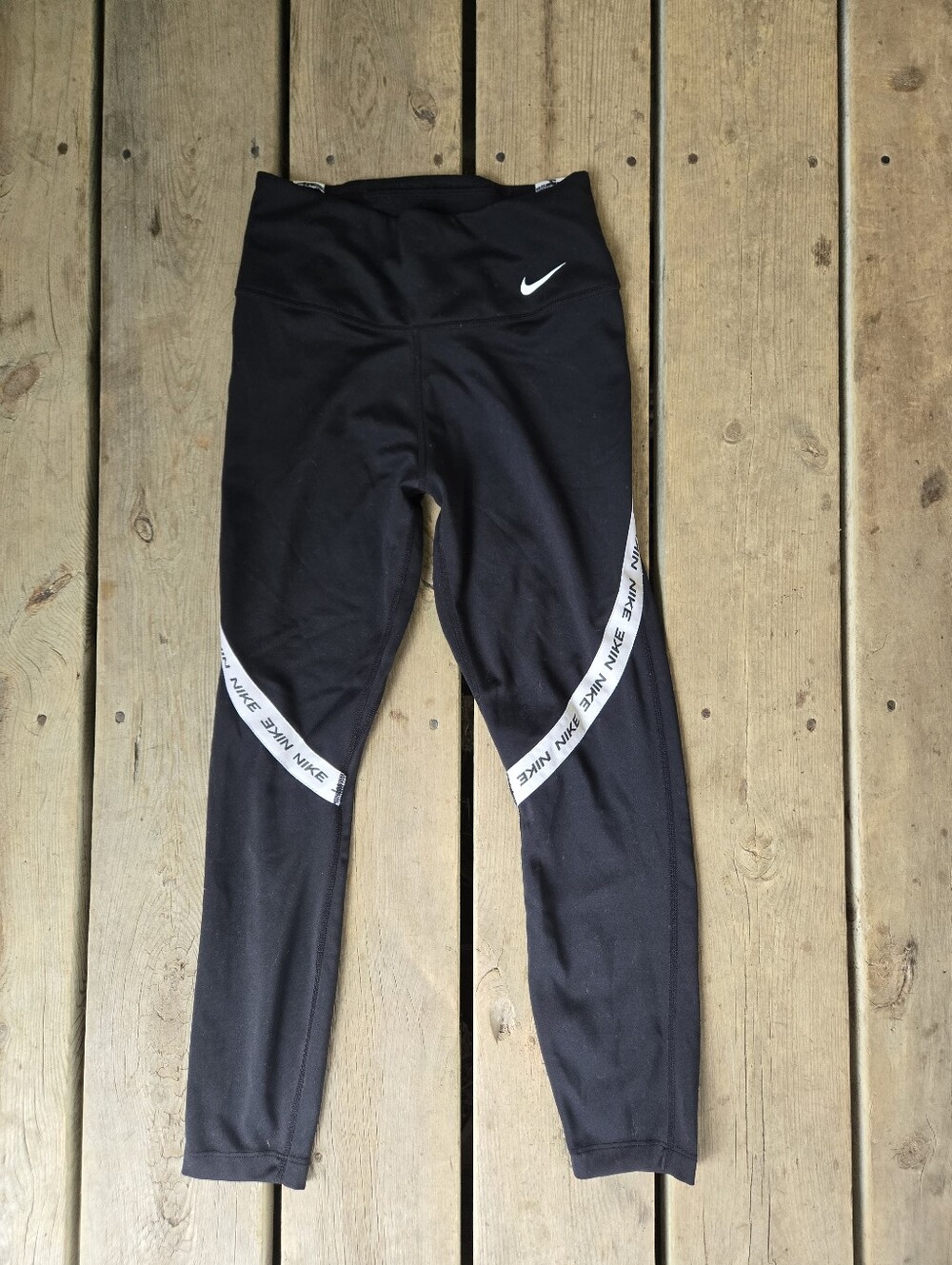 Nike black athletic leggings, w/ the spell out logo, size XS in great condition